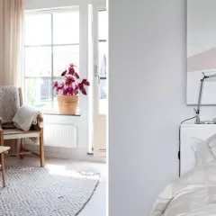 Mysigt litet sovrum inspiration med en bekväm soffa, ett träbord och en stol med plädar. På andra sidan syns en säng med randigt påslakan.