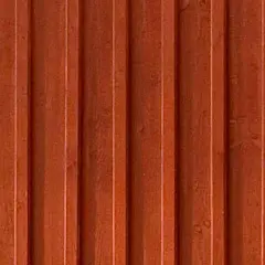 En vägg av gammaldags lockpanel i faluröd färg. Träets ådring syns svagt under färgen.