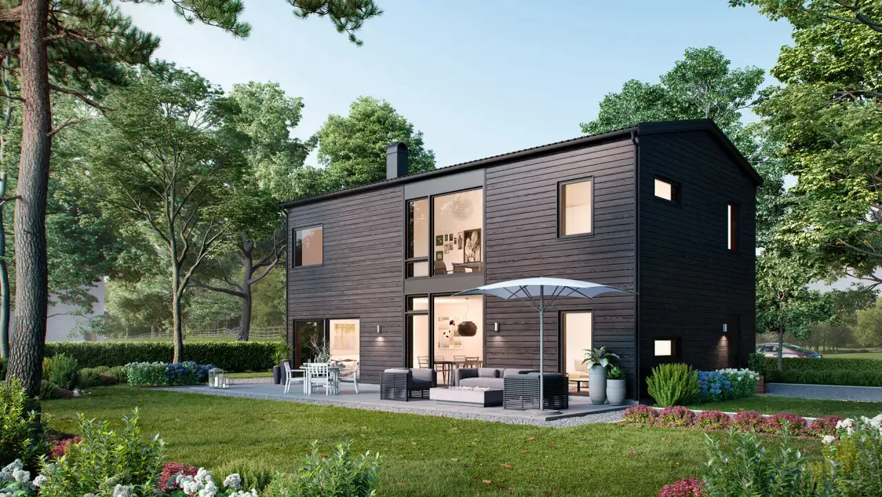 Mörkt modernt hus med stora fönster och uteplats. Perfekt utbyggnad hus inspiration för en grönskande trädgård.